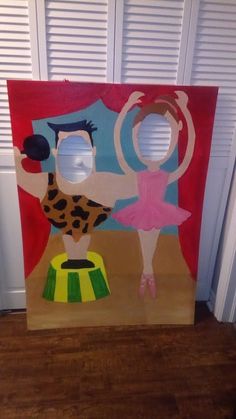 a cardboard cut out of a ballerina and a giraffe