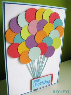 a birthday card with colorful balloons on it