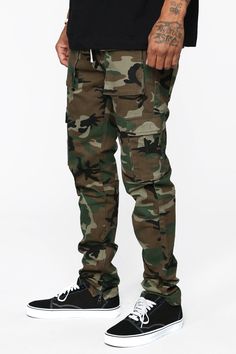 Available In Black, Khaki, Olive, Burgundy And Camo Button Closure Drawstring Zip Fly Side Hand Pockets Back Pockets Cargo Pockets Ankle Zip Skinny Fit 31' Inseam Slim Fit 97% Cotton 3% Spandex Imported | Mens Hunter Slim Cargo Pants in Camouflage size 34 by Fashion Nova Tommy Clothes, Cargo Pants Camo, Camouflage Fashion, Man Hunter, Camo Men, Camo Fashion, Camo Cargo Pants, Mens Pants Fashion, Print Placement