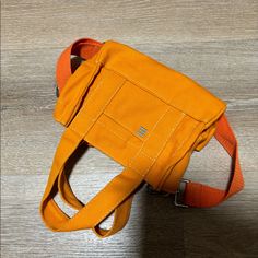 Urban Outfitters Orange Canvas Mini Tote Bag Brand New Cotton Canvas Bag, Never Use Summer Statement Piece Orange Canvas Shoulder Bag For Everyday Use, Orange Everyday Canvas Shoulder Bag, Everyday Orange Bags With Pockets, Casual Orange Satchel With Double Handle, Urban Outfitters Travel Bags For Summer, Urban Outfitters Summer Travel Bags, Orange Summer Bags For Errands, Casual Orange Bag For Errands, Orange Satchel With Mobile Phone Bag For Everyday Use