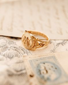 The Marie Antoinette Ring her monogrammed rIng MA, she was the queen of France brfore the French Revolution. This beautiful ring made of 18k gold plated silver and inscribed inside Eat Cake. Timeless Promise Ring With Initials, Timeless Initials Promise Ring, Timeless 14k Gold Rings With Initials, Heirloom Engraved Round Band Rings, Classic Open Ring Jewelry With Initials, Formal Jewelry With Initials On Open Ring, Formal Jewelry With Initials Open Ring, Formal Jewelry With Initials In Open Ring Shape, Timeless Gold Initial Ring For Promise