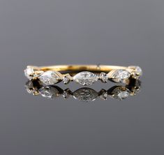 an antique diamond ring with five diamonds