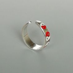 A sterling silver toe ring enameled with a red and white yin yang design. 5mm wide. This is an open ended toe ring and can be adjusted to fit most feet. These toe rings are made of 925 hypoallergenic sterling silver. Please note this price is for ONE toe ring only. Sent in a gift box. I can include a personal message from you if needed You are welcome to contact me at... bhavnakwintra1956@gmail.com For more beautiful pieces from my shop, please browse 👇 TOE RINGS: https://www.etsy.com/your/shop Adjustable White Toe Rings As Gift, Adjustable White Toe Rings For Gift, White Sterling Silver Toe Rings For Gift, White Sterling Silver Toe Rings As Gift, Sterling Silver White Toe Rings As Gift, Yin Yang Designs, Sterling Silver Toe Rings, Silver Toe Rings, Jewelry Minimalist