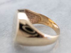 This is a hefty, thick and solid piece with no decoration or motifs to mar the amazing finish. Signet rings have a long history. Originally carved with a Family Crest, they were used to seal letters and documents by embossing the crest in wax. Over time they have evolved into day to day jewelry, which can be engraved with any crest, monogram or initial one desires. Market Square Jewelers works with one of the finest hand engravers in the northeast. With over 30 years of experience, our engraver Classic Engraved Ring With Hallmarks, Luxury Engraved Signet Ring Collectible, Classic Ceremonial Signet Ring With Polished Finish, Concave Signet Ring With Polished Finish For Anniversary, Antique Wide Band Engraved Jewelry, Antique Engraved Wide Band Jewelry, Timeless Hallmarked Signet Ring Collectible, Timeless Hallmarked Signet Ring For Collectors, Timeless Hallmarked Collectible Signet Ring