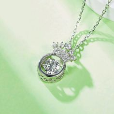 An eye-catching round moissanite dances with ease at the center of this appealing women's necklace, expressing your unstoppable love. Additional round gem set in sterling silver frame the center. Features Moissanite was originally found in meteorites(Chemical name: Silicon Carbide). It was first discovered in 1893, while a scientist was examining meteor samples from a crater in Arizona. After many years, the experts has been recreated moissanite in the laboratory, that make the gemstone with fri Moissanite Necklace With Center Stone In Round Cut, Dazzling Round Necklace With Center Stone, Dazzling Necklace With Center Stone, Moissanite Necklace With Center Stone As Gift, Dazzling Round Necklaces With Center Stone, Anniversary Necklace With Round Center Stone, Anniversary Cubic Zirconia Necklace With Center Stone, Diamond White Necklace With Center Stone In Round Pendant, Sterling Silver Necklace With Center Stone