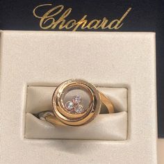 18 Karat Rose Gold Chopard Ring With A Weight Of 5.80 G. The Ring Contains Three Diamonds With A Weight Of 0.15 Carats. Size 6.25 Timeless Gold Diamond Ring For Evening, Fine Jewelry Yellow Gold Rings, Aaa Quality Fine Jewelry Yellow Gold Rings, Luxury Aaa Quality Rings For Formal Occasions, Aaa Quality Diamond Ring For Anniversary, Aaa Quality Diamond Anniversary Ring, Timeless Yellow Gold Diamond Ring For Evening, Luxury White Gold Rings With Rotating Bezel, Luxury 14k Gold Diamond Ring For Evening