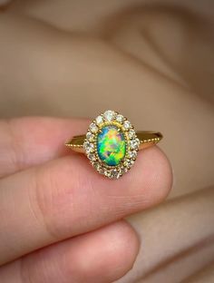 Item Information opal:              0.48cts Weight (ring)     3.60g Size (ring)      10×12mm Weight (diomand):  0.35cts The size of the ring can be adjusted Attention：All Opal stones are from Australia, and some of the finished products are designed and processed in China.So Opal products in my store are delivered by Chinese factories. More Affordable price，Only make a reasonable profit，So I can offer a high quality item and affordable price for every customers， Better service ，if you have any problem with my item，please feel free to contact me， I will try my best to solve it. Free EMS Luxury Yellow Gold Opal Ring With Halo Setting, Ethiopian Opal Oval Rings For Anniversary, Heirloom Oval Opal Ring, Heirloom Style Round Opal Ring, Heirloom Opal Ring, Formal Yellow Gold Ethiopian Opal Ring, Oval Opal Fine Jewelry Ring, Luxury 14k Gold Opal Halo Ring, Luxury Multi-stone Opal Ring For Wedding