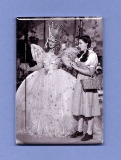 an old photo of two women dressed as princesses