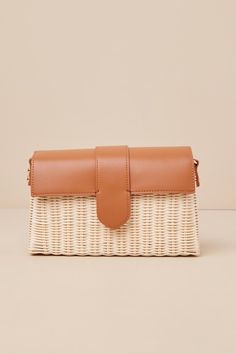 Everyone will be in awe of your elevated aesthetic when they spot you carrying the Moda Luxe Enviable Taste Brown and Ivory Woven Crossbody Bag! This chic bag has a structured woven silhouette with a rectangular design and a flat bottom. Sleek, faux leather top flap has a magentic clasp closure that opens to reveal a roomy interior with a zippered pouch and a sidewall pocket. Style it with the attachable shoulder strap or handbag strap, so you can always match your look! Lined. Bag Measures 10. Cream Woven Crossbody Bag, Natural Color Clutch Shoulder Bag With Detachable Strap, Beige Straw Pouch Bag With Detachable Strap, Beige Straw Crossbody Bag With Detachable Strap, Beige Crossbody Straw Bag With Detachable Strap, White Woven Clutch Bag, Rectangular Satchel With Removable Pouch For Day Out, Natural Color Bag With Detachable Strap For Day Out, Natural Color Bags With Detachable Strap For Day Out