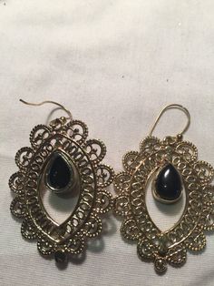 Delicate and detailed black onyx stone and Bronze earrings These dangle earrings are about 2 inch long All jewelry is shipped in a nice gift box. Check out our over a THOUSAND great reviews Black Bohemian Teardrop Earrings For Gift, Black Teardrop Metal Jewelry, Black Bohemian Teardrop Earrings As Gift, Bohemian Black Teardrop Earrings As Gift, Black Bohemian Pierced Jewelry, Formal Black Filigree Earrings, Elegant Black Metal Teardrop Earrings, Elegant Black Filigree Earrings, Black Filigree Earrings For Gift