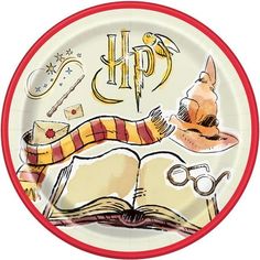 a plate with hogwarts symbols on it and an open book in the middle