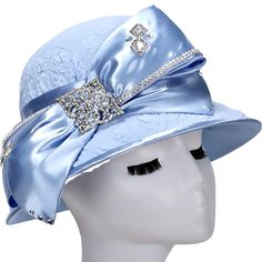 Giovanna Small Elegant Brim Hat Style: H0943 Color: Baby Blue Features stone embellishment & ribbons. Dimensions: Head Circumference 22.5” / Crown depth 4.75" / Brim width L:3", R: 1" / Diameter 10.5" Party Hat With Ribbon And Short Brim, Party Hats With Ribbon And Short Brim, Adjustable Bow Hat For Church, Adjustable Blue Hats For Church, Blue Adjustable Hat For Church, Adjustable Blue Hat For Church, Blue Rhinestone Hat For Summer, Adjustable Blue Hat With Rhinestones, Blue Adjustable Hat With Rhinestones