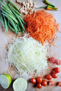 various vegetables are laid out on a cutting board