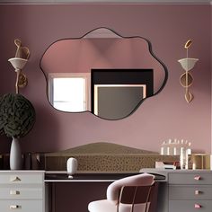 a mirror hanging on the wall above a desk with a chair in front of it