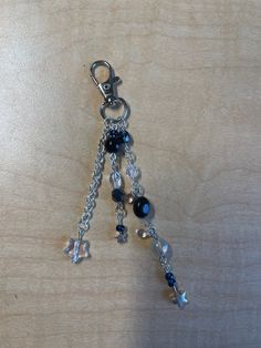 a key chain with charms attached to it