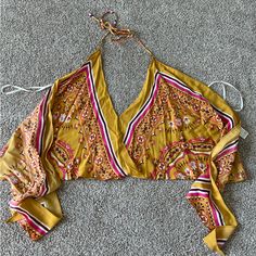 Super Cute Halter Top Ties In The Back Similar To A Scarf Top Size Small Never Worn Nwot Yellow Triangle Halter Top For Spring, Yellow Triangle Top For Spring, Spring Yellow Triangle Halter Top, Yellow Printed Festival Tops, Yellow Printed Tops For Festival, Yellow Triangle Halter Top For Summer, Yellow Halter Top For Spring Vacation, Chic Yellow Halter Top For Spring, Yellow V-neck Crop Top For Beach