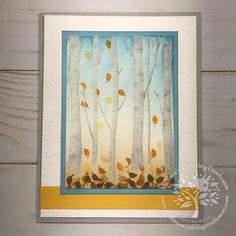 a card with trees and leaves on it