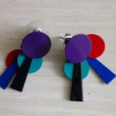 The Are A Purple, Red, Aqua, Black And Royal Blue Earring Set. They Are Directly Out Of The Early 80s. Never Worn. They Are 1.5 Inches Long. These Will Definitely Be Your "Go To" Earrings For Any And Every 80s Party That You Will Attend. These Also Just Add A Pop To Festival Clothing Or Really Anywhere You Want 1000 People To Say, "Oh My God, I Love Your Earrings." This Is My Final Price Before I Take Them Down And Just Keep Them Myself. They Are Just Too Cool. Modern Purple Earrings For Party, Retro Blue Party Earrings, Fun Purple Earrings For Party, Vintage Purple Earrings For Party, Retro Blue Earrings For Pierced Ears, Retro Multicolor Earrings For Parties, Royal Blue Earrings, Totally 80s, 80s Earrings