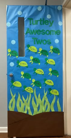 a door decorated to look like a turtle and other sea animals with words on it