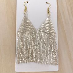 Lexie Solid Beaded Fringe Earrings Silver by Ink & Alloy - Lyla's: Clothing, Decor & More - Plano Boutique Silver Fringe Long Drop Earrings, Elegant Tassel Earrings For Festive Occasions, Elegant Summer Chandelier Earrings With Tassels, Elegant Summer Tassel Chandelier Earrings, Gold Beaded Earrings With Dangling Beads For Evening, Elegant Silver Tassel Earrings With Dangling Beads, Elegant Gold Beaded Earrings For Summer, Silver Party Jewelry With Beaded Fringe, Summer Party Chandelier Earrings With Tassels