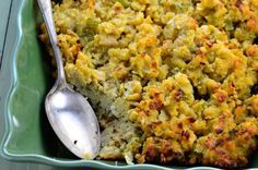 a casserole dish is shown with a spoon in it and on the side