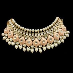 "A pure hand-drawn detailed jewelry in the shades of soft pink meena - this piece displays high-quality workmanship and fine usage of stones! Delicate necklace accented with kundan stones and faux pearls creating a lush, sparkling set. The set includes a pair of matching dangle earrings. Approximate earrings length is 3\". SET INCLUDES : Necklace & Earrings Tikka can be added to the set Details: Handcrafted Metal: Gold Plated, Metal Alloy Stone: Kundan & Meenakari Work Closure: Post for Elegant Pink Pearl Necklace For Festivals, Pink Pearl Drop Chandbali Jewelry, Pink Pearl Drop Chandbali Earrings, Elegant Pink Meenakari Jewelry, Pink Pearl Drop Jewelry For Festivals, Elegant Pink Bridal Necklace With Tilla, Elegant Pink Tilla Bridal Necklace, Pink Kundan Chandbali Necklace With Meenakari, Pink Chandbali Kundan Necklace With Meenakari