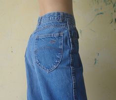 Faded Vintage chic jeans W25 W26 High waist pants Blue denim jeans,Blue jeans,retro,hipster pants,jeans classic,jeans,chic made in usa I want you to experience the beauty, style and comfort of my goods. Vintage chic jeans condition : vintage but Good color : Blue jeans Fabric Denim Label : 100% cotton Mede in usa Please refer to the pictures for more details. / I check measurements centimeters or inches 1. Waist: 25-26 inch // 63.5 or 66 cm 2. Hips: 39 or 40 inch // 99 or 101.5 cm 3. Rise: 12 in Faded Mid-rise Bottoms In 90s Style, 90s Style Mid-rise Faded Bottoms, 90s Style Faded Mid-rise Bottoms, Retro Style Faded Bottoms With Five Pockets, Retro Faded Bottoms With Five Pockets, Light Wash Vintage Wide Leg Bottoms, Faded High Waist 90s Bottoms, 90s High Waist Faded Bottoms, Vintage Light Wash Wide Leg Bottoms