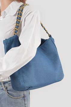 This Denim Fashion Tote Bag is the perfect accessory for any outfit! Made with durable denim material, it offers both style and functionality. Its spacious design allows you to carry all your essentials while still looking fashionable. Upgrade your wardrobe with this must-have bag. Width - 12.5"Depth - 4"Height - 10"Composition - Denim & Mix MetalsLead & Nickel Compliant Blue Denim Shoulder Bag For Daily Use, Trendy Denim Shoulder Bag For Daily Use, Denim Blue Shoulder Bag With Large Capacity, Large Capacity Denim Shoulder Bag In Blue, Daily Use Denim Shoulder Bag With Zipper, Daily Use Denim Shoulder Bag With Zipper Closure, Trendy Denim Shoulder Bag With Double Handle, Denim Shoulder Bag With Zipper For Daily Use, Casual Denim Shoulder Bag For Everyday