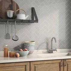 a kitchen counter with bowls and utensils on it