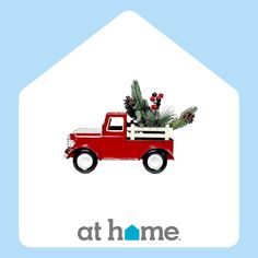 a red truck with a christmas tree in it's bed on a blue background