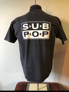 Vintage Sub Pop Tshirt  - 90's vintage  - Rare Loser Spell Out Shirt - Double sided graphic  - Sub Pop logo back graphic  - Single stitch sleeves  - Oneita tagged  - Rare Black colour way  Size: L  21"x27" Great vintage condition No rips or holes  No stains Urban Screen Print Top For Concert, Band Merch Tops With Logo Print, Urban Style Pre-shrunk Tops For Concert, Pre-shrunk Band Merch Tops For Streetwear, Retro Logo Print Tops For Streetwear, Retro Letter Print Shirt For Streetwear, Vintage Fitted T-shirt With Logo Print, Fitted Vintage T-shirt With Logo Print, 90s Logo Print T-shirt For Concerts