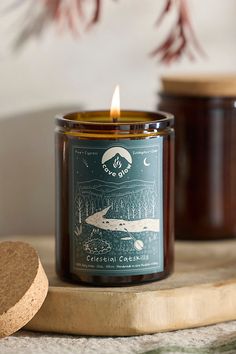 a candle sitting on top of a wooden board