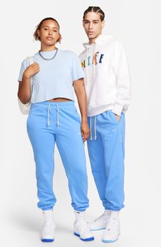 Midweight cotton-blend French terry with sweat-wicking Dri-FIT tech offers superior comfort in laid-back sweatpants with sporty appeal. 28 1/2" inseam; 10" leg opening; 13 1/2" front rise; 16 1/2" back rise (size Medium) Elastic/drawstring waist Side welt pockets Elastic cuffs 61% cotton, 39% polyester Machine wash, tumble dry Imported Men's Clothing Spring Cotton Sweats In Athleisure Style, Sweat Resistant Blue Sportswear Bottoms, Sweat-resistant Blue Sportswear Bottoms, Functional Cotton Sweat-resistant Activewear, Blue Sporty Sweat-resistant Bottoms, Sporty Blue Sweat-resistant Bottoms, White Joggers With Comfort Waistband For Sports, Casual Cotton Sweatpants For Sports Season, Casual Cotton Sweats For Sports