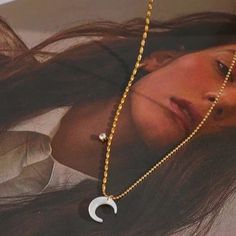 Rock the Luna Necklace and channel your inner moon goddess. This stunning white shell moon pendant will add a touch of whimsy and magic to any outfit. Perfect for those who love to stand out and embrace their unique style. (Moon babes unite!) Material: Gold plated hypoallergenic stainless steel, natural shell, zircon (waterproof & tarnish resistant) Chain length: 40cm + 5cm extension Trendy Moon Charm Jewelry As Gift, Trendy Moon Charm Jewelry Gift, Trendy Crescent Jewelry Gift, Trendy White Stainless Steel Jewelry, White Moon Charm Necklace, White Half Moon Necklace With Moon Charm, Trendy Moon-shaped Necklace For Gift, Trendy Moon Shaped Necklaces For Gifts, White Moon-shaped Clavicle Necklace