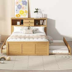 a bed sitting in the middle of a room next to a dresser with drawers on it