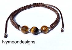 Handmade beaded bracelet made with natural tiger eye beads and real sterling silver beads      -brown waxed cotton thread-1.2mm     -natural tiger eye beads-8mm     - real sterling silver beads-3mm Waterproof bracelet, unisex, adjustable  Tigers-Eye has strong grounding energy that will make sure your physical body is connected to the earth. This stone will infuse you with confidence so that you can fulfill any role, perform any task, and speak to anyone with wisdom and grace. This will ensure t Brown Bracelet With Silver Beads, Adjustable Brown Jewelry With Silver Beads, Brown Silver Beads Bracelet Jewelry, Brown Silver Beaded Bracelet, Brown Bracelets With Silver Round Beads, Adjustable Brown Beaded Bracelet With Gemstone Beads, Adjustable Brown Gemstone Beaded Bracelets, Handmade Braided Bracelets With Brown Round Beads, Handmade Brown Braided Bracelets With Round Beads