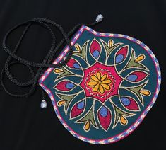 "Beautiful side bag handcrafted by members of the kuchi tribe. embroidery and well detailed in accordance to the kuchi member's taste.  A great piece for everyday wear! measurements: the purse is 7\" inches in length, 8\" inches in width the strap is 21\" inches" Traditional Pouch For Everyday Use And Festivals, Traditional Pouch For Festivals, Traditional Bags With Multicolor Embroidery And Handwork, Traditional Shoulder Bag With Handwork Pouch, Handmade Shoulder Bag With Multicolor Embroidery For Festivals, Traditional Hand-stitched Bags For Festival, Handmade Traditional Pouch For Festivals, Traditional Handmade Pouch For Festivals, Handmade Multicolor Embroidered Shoulder Bag For Festivals