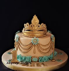 a cake decorated with blue and gold decorations