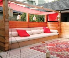 a couch sitting on top of a wooden deck