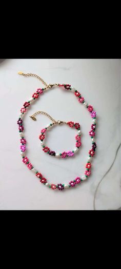 This is a very elegant handmade necklace, the colors chosen by the customer.we just offer you the example. This is my little project that I hope you like Handmade Pink Pendant Flower Necklace, Multicolor Beaded Necklace With Flower Pendant For Gift, Multicolor Beaded Necklace With Flower Pendant, Flower Shaped Single Strand Beaded Necklace For Gift, Flower Shaped Single Strand Jewelry For Gifts, Pink Flower Necklace With Round Beads For Gift, Pink Flower Necklace With Colorful Beads As Gift, Colorful Beaded Flower Pendant Necklace As Gift, Flower Pendant Necklace With Colorful Beads As Gift