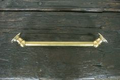 an old wooden door with a brass handle