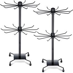 two black metal racks with wheels on them