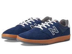 New Balance Numeric 425 - Skate Shoes : Navy/Gum 2 : Move with ease from the boardwalk to the bar in the New Balance Numeri 425 sneakers! Lace-up closure. Coastal-inspired court shoes taking cues from the 520 and 620 styles. Suede, synthetic and mesh upper for comfort and durability. Textile lining and insole. Padded insole for all-day comfort. Non-marking rubber outsole offers long-lasting wear. Imported. Measurements: Weight: 13 oz Product measurements were taken using size US Men's 12, Women' Casual Slip-resistant Skate Shoes For Streetwear, Casual Slip-resistant Skate Shoes With Round Toe, Sporty Slip-resistant Skate Shoes With Round Toe, Sporty Slip-resistant Skate Shoes, Casual Slip-resistant Lace-up Skate Shoes, Casual Lace-up Slip-resistant Skate Shoes, Slip-resistant Round Toe Skate Shoes For Sports, Sporty Fade-resistant Skate Shoes For Skateboarding, Sporty Slip-resistant Skate Shoes For Skateboarding