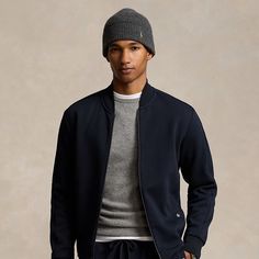 This flight-inspired jacket is crafted with a smooth double-knit fabric that offers water-repellent properties. Modern Track Jacket With Ribbed Cuffs, Modern Long Sleeve Track Jacket With Ribbed Cuffs, Sporty Ralph Lauren Fall Outerwear, Fitted Track Jacket With Ribbed Cuffs For Work, Sporty Fitted Outerwear With Ribbed Collar, Classic Outerwear With Ribbed Cuffs For Layering, Double Knit, Mens Outerwear, Double Knitting