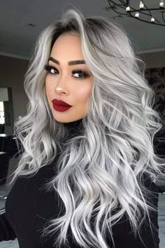 From the sexy long silver hair with shadow root that's just slightly grown out like you see here to bold dip dye style contrasts, there are a ton of cool hairstyles for silver hair. Click through for 40+ hottest silver hair ideas or save this pin for later! Long Black And Silver Hair, Dark Gray Ombre Hair, Long Black Hair With Gray Highlights, Grey Silver Hair Color, Highlights Grown Out, Silver Hair Women, Blonde With Silver Highlights, Ice Grey Hair, Red And Grey Hair