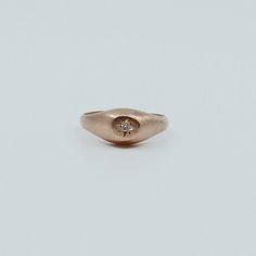 This Dome Signet Ring is minimally set with a diamond. One of our mainstay favorites here on the shop! Wear as a pinky ring, or choose a bigger size to wear on another finger. Details: 14k gold (available in rose, yellow or white) White diamond measures about 1.4mm **leave a note in your cart if you'd like to get this ring with a polished finish instead of a brushed finish.****also, please leave a note with desired gold color - rose, yellow, or white** Free Shipping on Domestic Orders Materials: Pinky Signet Ring, Rose Yellow, Pinky Ring, White White, Signet Ring, White Diamond, Gold Color, Diamond Ring, Silver Rings