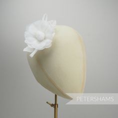 Need a silk flower on the smaller side? This petite 'Norma' flower is made from layers and layers of silk, with each petal being shaped and bound together on a wired stem with a set of wired leaves and rolled loops at the back. The fabric is a really lightweight, floaty silk and it hardly weighs a thing. Simply perfect for adorning a hat or headpiece. Flower measures approximately 8cm (3.1 inches) Length of wired stem: 7cm (2.7 inches) For our full range of silk hat flowers visit our Etsy shop h Elegant Flower-shaped Hair Accessories With Handmade Flowers, Elegant Handmade Flower Hair Accessories, Elegant Flower Hair Accessories With Handmade Flowers, Elegant Flower Headpieces For Gifts, Elegant Headpiece With Handmade Flowers, Elegant Headpieces With Handmade Flowers As Gift, Elegant Flower Hair Accessories For Spring, Elegant Spring Flower Hair Accessories, Elegant Hats With Handmade Flowers As Gift