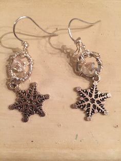 "~WINTER WONDERLAND~ A perfect gift idea, or just a gift to yourself!! This pair of earrings would also look fabulous in a bridal party. Silver Snowflake Earrings -- Cozy Winter Weather { D e s c r i p t i o n } Small delicate silver snowflakes with wonderful intricate design, done in a matte finish {not a high-polish shine}. These earrings delicate and lightweight, yet sturdy enough to be unbending with any normal wear and handling. Ear wires are small simple silver hooks in a high-polished shi Winter Jewelry, Snowflake Earrings, Wrapped Earrings, Silver Snowflakes, Earrings Elegant, Wire Wrapped Earrings, Delicate Earrings, P T, Jewelry Vintage