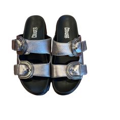 Cougar Pepa Platform Sandal Silver Metallic Nwot Size 8 Go Bold By Centering Looks Around The Pepa Platform Sandals From Cougar. Set On A Platform Sole With Aggressive Sawtooth Treads, This Open-Toe Sandal Features Slide Straps With Modern, Tonal Buckles That Coordinate With The Upper. Featuring: Water-Repellent & Stain-Resistant Leather Upper Slip-On Round Open Toe Leather Lining & Footbed 1½" Platform Heel Silver Sandals With Buckle Closure For Summer, Silver Closed Toe Casual Sandals, Silver Flat Heel Sandals With Buckle Closure, Casual Silver Round Toe Sandals, Casual Silver Flat Heel Sandals, Silver Sandals With Round Toe For Vacation, Silver Leather Slides For Summer, Silver Open Toe Casual Sandals, Silver Casual Sandals For Summer