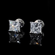 2ctw or 4ctw Princess Cut Lab Grown Diamond Earrings in Tulip Setting ---------------------------------------------------- ⁕Diamond Type: Lab Grown Diamonds ⁕Shape: Princess Cut ⁕Total Carat Weight: 2ctw or 4ctw (choose in dropdown menu) ⁕Center Stone Weight: 1ct. each or 2ct. each ⁕Color: DEF (colorless) ⁕Clarity: VS/VVS (eye clean) ⁕Certified: Yes ⁕Metal: 14k Yellow/Rose/White  ⁕Style: Push Back or Screw back  ------------------------------------------------------------ This item can be custom Luxury Princess Cut Earrings, Classic Princess Cut Diamond Earrings In Sterling Silver, Classic Princess Cut Sterling Silver Diamond Earrings, Classic Platinum Bridal Earrings With Diamond Cut, Classic Princess Cut Brilliant Earrings, Classic White Princess Cut Earrings, Princess Cut Brilliant Earrings In Fine Jewelry, Classic Cubic Zirconia Earrings For Formal Occasions, Classic Princess Cut Diamond White Earrings